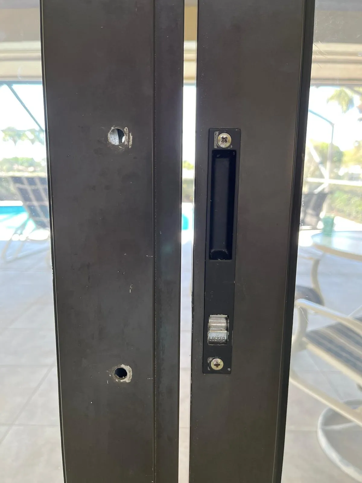 Broken sliding door lock mechanism on a Florida patio door