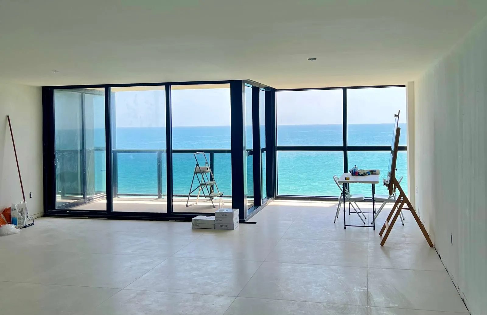 Impact sliding glass doors in a high-rise condo overlooking the ocean in South Florida